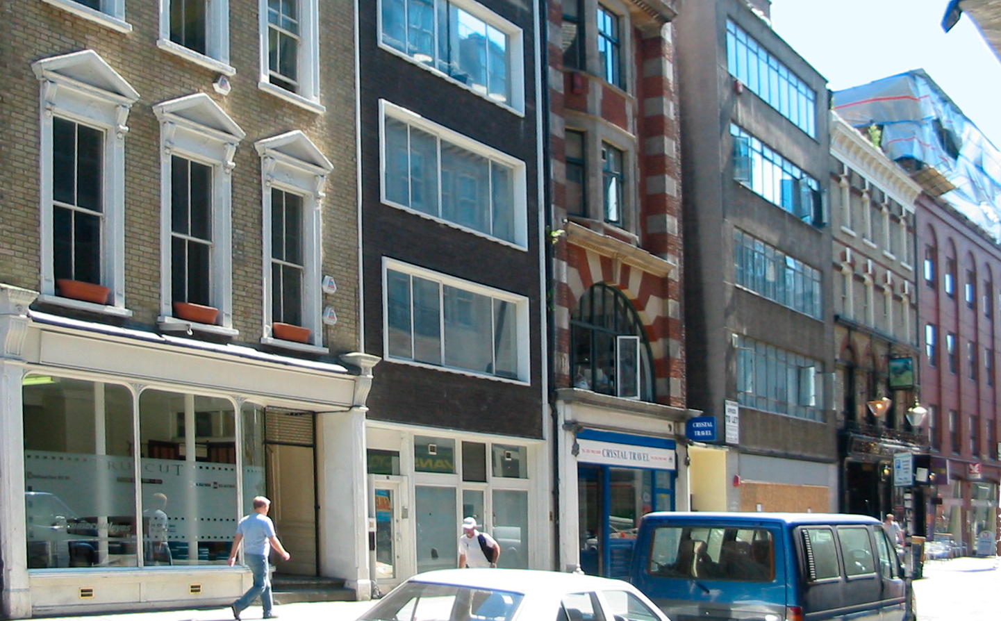 A street lined with different types of buildings.