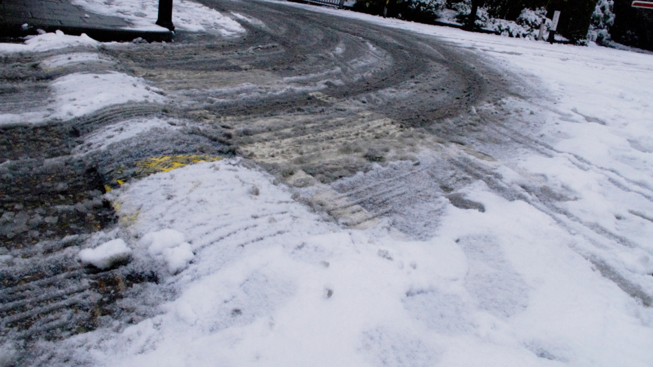 A driveway with ice and slush.