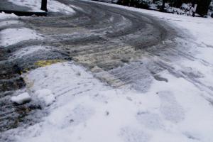 A driveway with ice and slush.