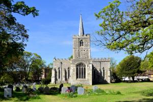 A large church set in a graveyard.