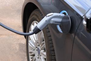 A close-up of an electric vehicle charging.