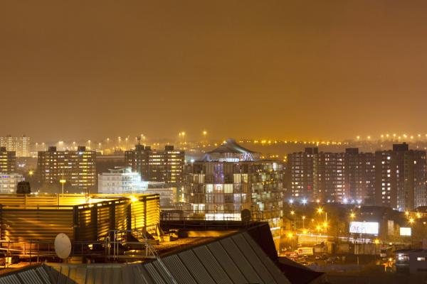 A view over a city bathed in artificial light.
