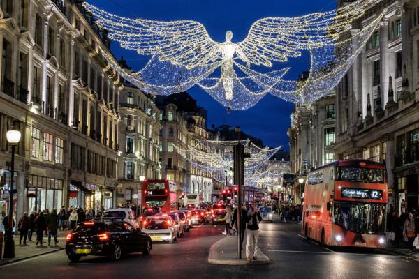 Regent Street in London with Christmas lights and buses.